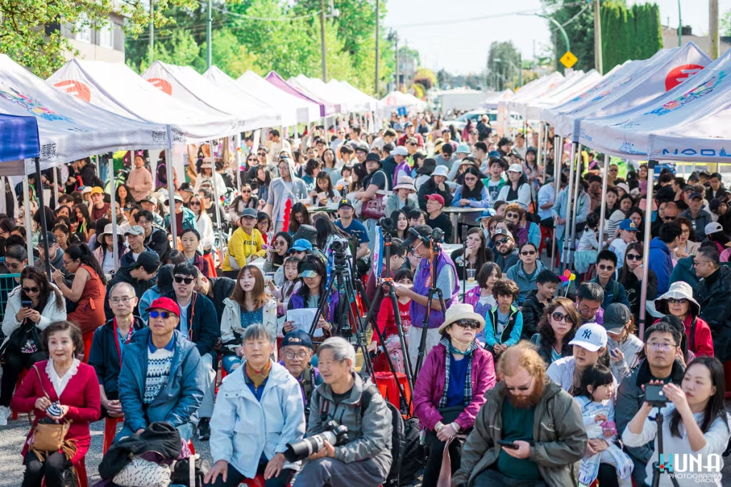 TJ Fest 2025 Kuna Photography: Vancouver Event Photographer. Densely packed audience on red stools watching live entertainment at TJ Fest street fair in BC.