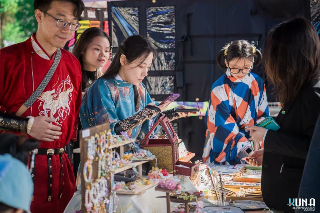 TJ Fest 2025 Kuna Photography: Vancouver Event Photographer. Visitors browsing a handmade jewelry stall by Vancouver Hanfu Culture Association at TJ Fest, BC.