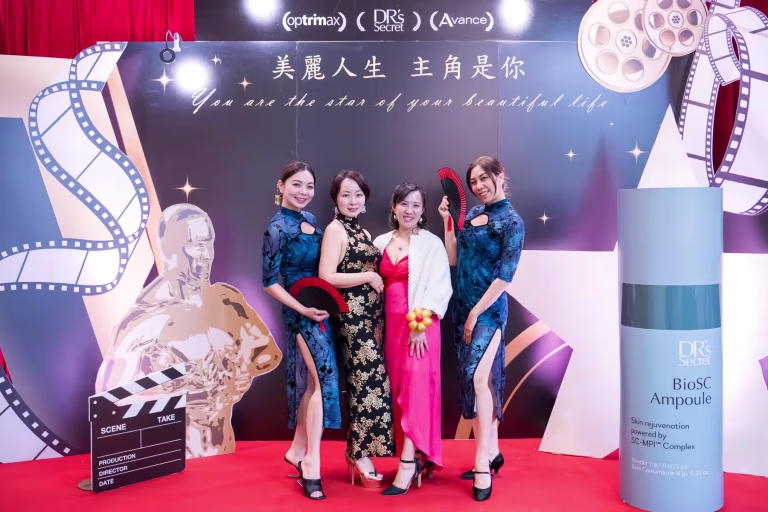 Vancouver event photography captures Four elegant attendees posing in traditional cheongsams and gowns on the red carpet at the Dr's Secret beauty event at The Westin Wall Centre, showcasing premier Vancouver event photography in Richmond, Metro Vancouver, British Columbia, Canada.