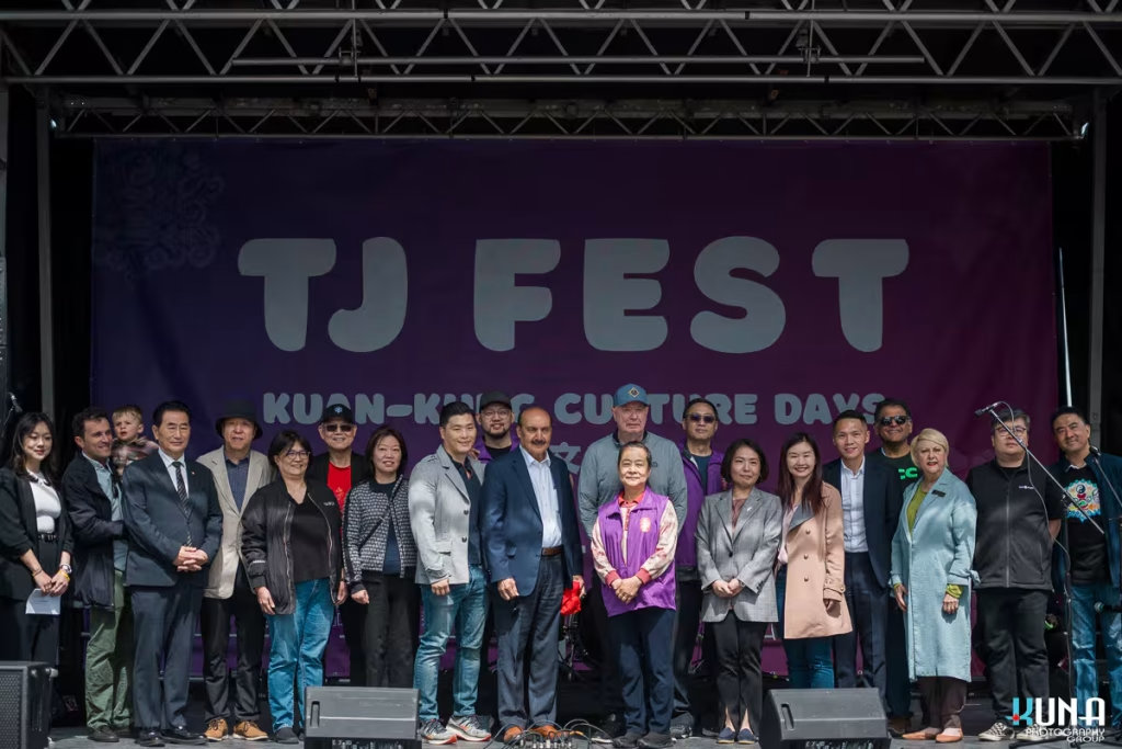 Local politicians, community leaders, and VIP organizers standing together on the main stage during TJ Fest event photography in Metro Vancouver.