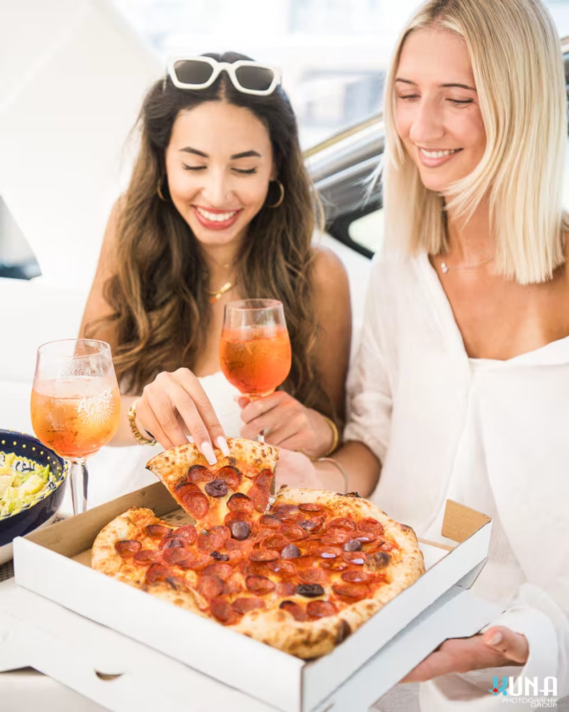 Pizza on a boat for Capo and the Spritz. Captured by commercial photographer Kuna Photography.