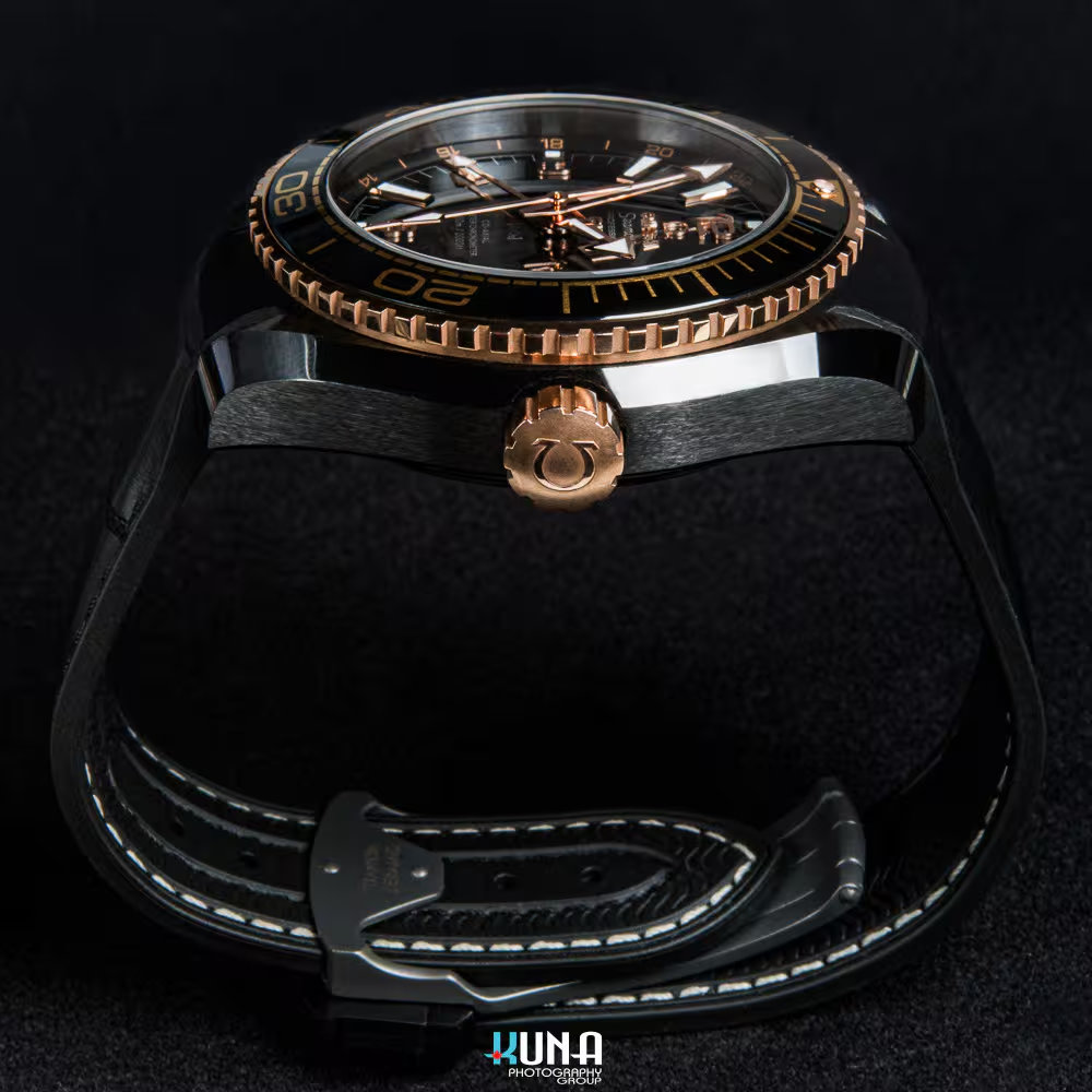 Kuna Photography - Omega Seamaster Side Profile & Gold Crown Kuna Photography commercial product photographer profile shot showing the thickness and craftsmanship of the Omega Deep Black ceramic case.