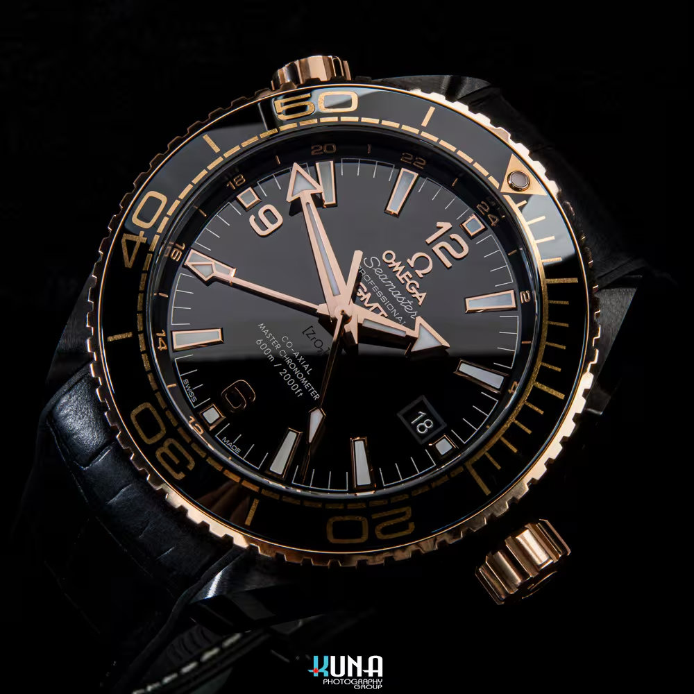 Kuna Photography - Commercial Watch Shot: Omega Deep Black Kuna Photography commercial product photographer top-down flat lay of Omega Seamaster Planet Ocean Deep Black watch face.