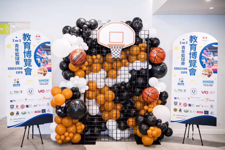 Richmond event photography captures the vibrant basketball balloon backdrop at the TCCBC Education Expo in Richmond, Metro Vancouver, British Columbia.