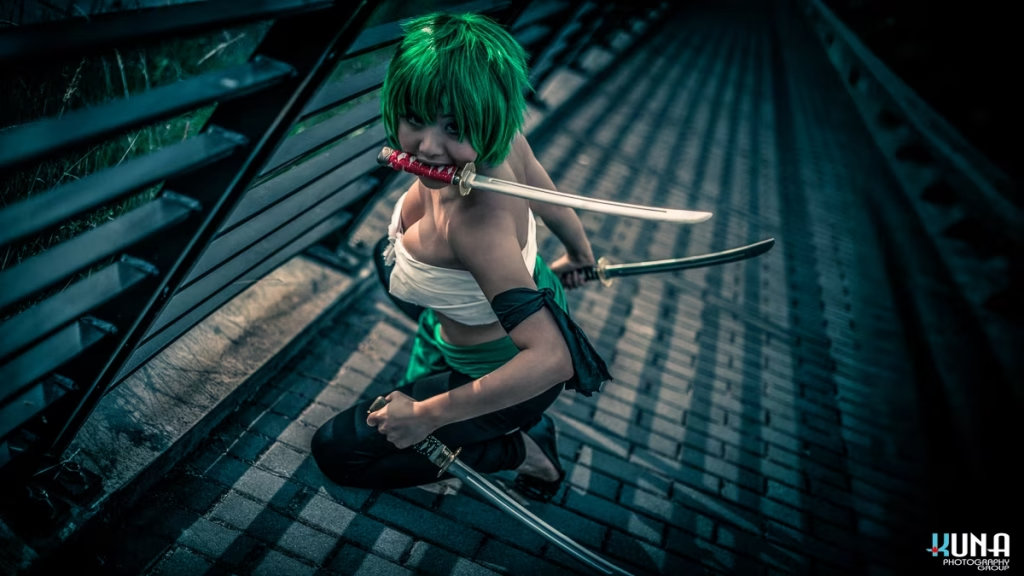 High angle shot of female Zoro cosplayer on paved walkway with swords, captured by Vancouver Cosplay Photographer Kuna Photography
