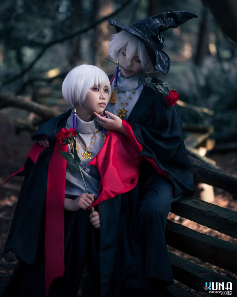 Vancouver cosplay photographer capturing a dramatic duo from Sky: Children of the Light holding red roses in a moody forest setting.