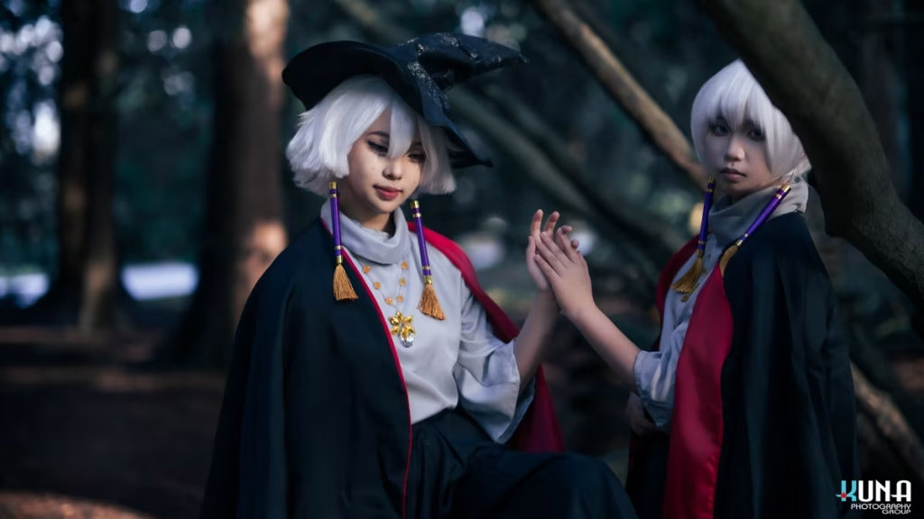 Close up portrait of a Sky: Children of the Light (光遇) cosplay duo holding hands with soft forest lighting, by a Vancouver cosplay photographer.