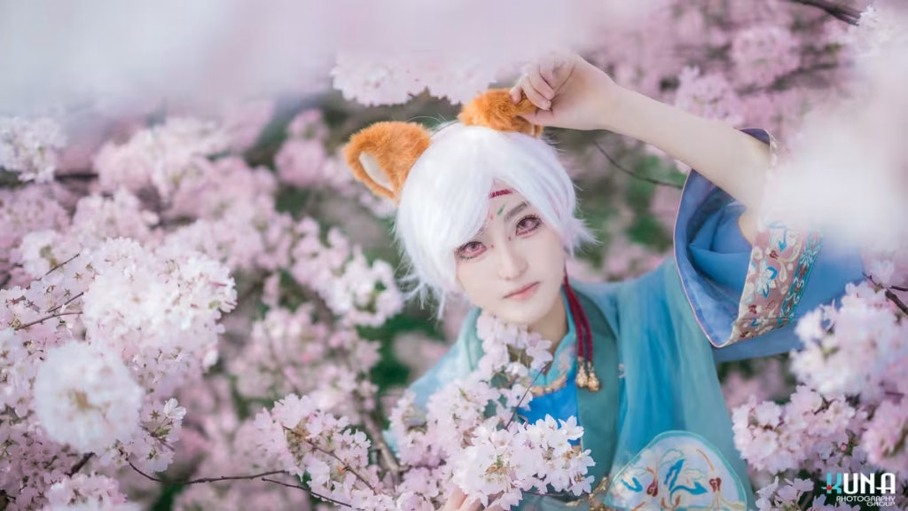 Detailed headshot of a Vancouver cosplayer with fox ears surrounded by blooming Sakura.
