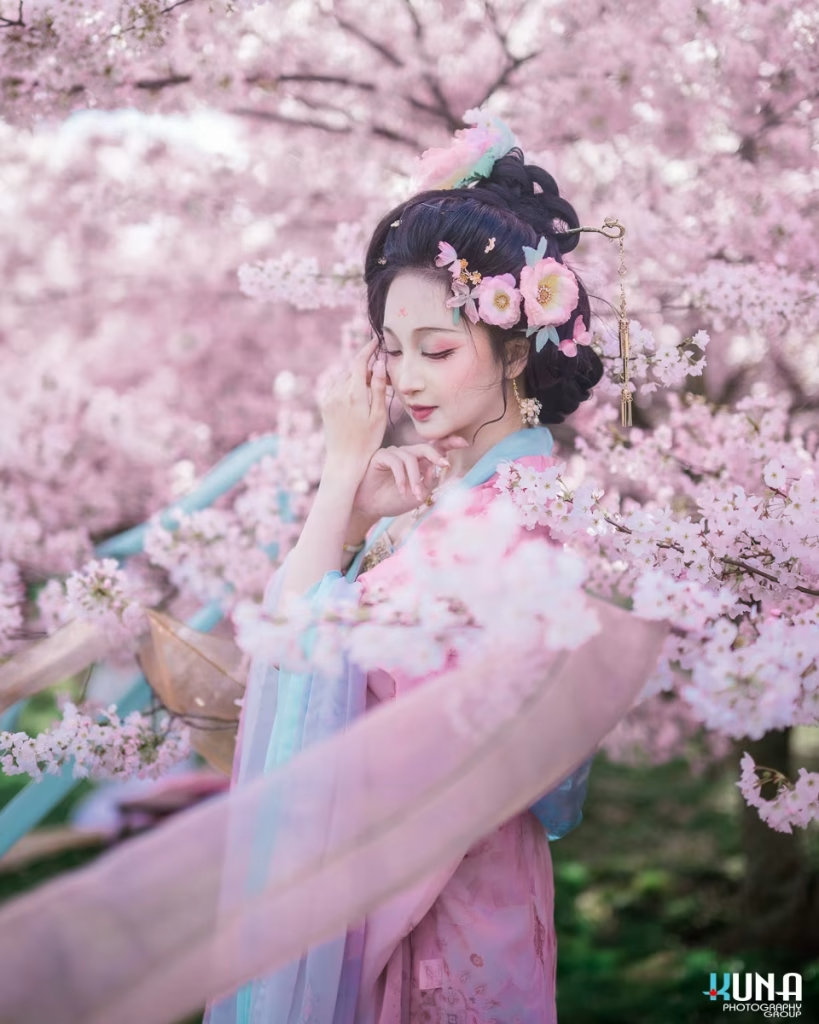 Peaceful Hanfu portrait of a woman with eyes closed feeling the spring breeze.