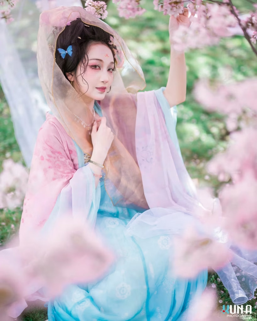 Creative Hanfu portrait with a sheer golden veil draped over the head.