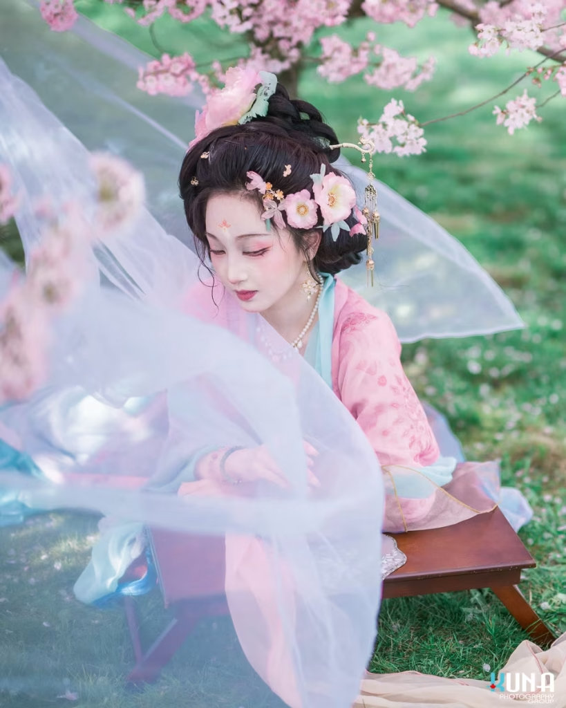 Hanfu photoshoot featuring flowing sheer white silk fabric in the wind.