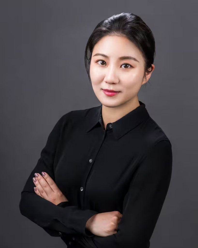 Beryl Liu, real estate sales advisor at VanHaus, captured in a polished black blouse for a vancouver studio headshot.