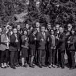 Vancouver headshot photographer, professional mobile studio portrait photography, capturing a black and white group portrait of CIBC leader Alex Fan and his executive team giving thumbs up during a professional leadership meeting in Whistler.