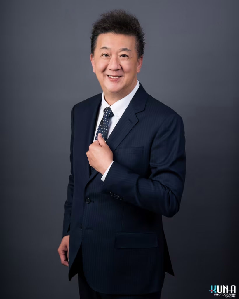 Distinguished corporate board member headshot of a senior male TCCBC director in a pinstripe suit in Vancouver British Columbia