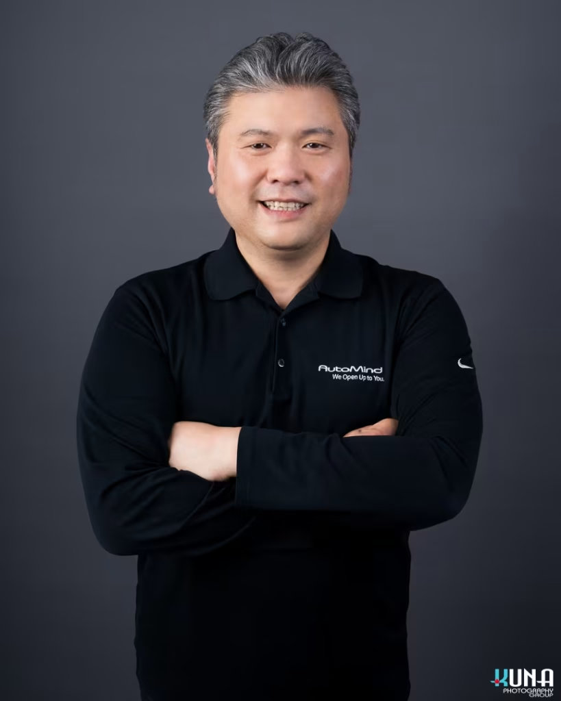 Corporate board member headshot of a male TCCBC director wearing an AutoMind branded polo in Vancouver British Columbia