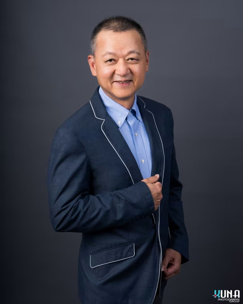 Sharp professional board member headshot of a male TCCBC director in a custom piped blazer in Vancouver British Columbia
