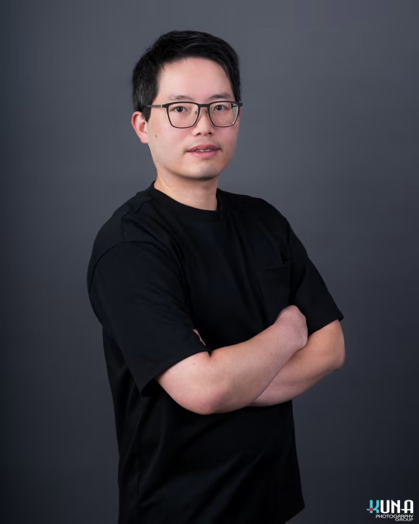 Contemporary professional board member headshot of a male TCCBC director wearing glasses in Vancouver British Columbia
