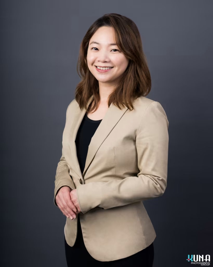 Confident professional board member headshot of a female TCCBC director in a beige blazer in Vancouver British Columbia