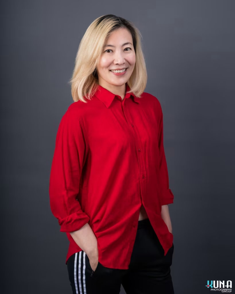 Professional corporate board member headshot of a female TCCBC director wearing a red shirt in Vancouver British Columbia