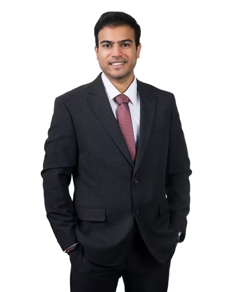 Sai Madishetty, commercial and residential sales REALTOR® at VanHaus, smiling warmly for his vancouver real estate headshot.