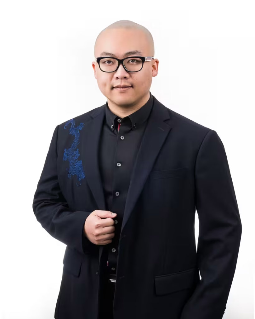 An executive director at VanHaus posing for a professional vancouver real estate headshot on a bright studio backdrop.