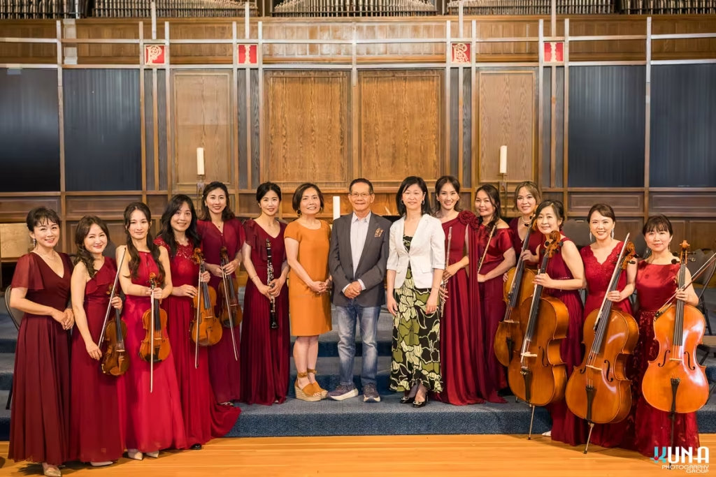VIP guests and sponsors posing on stage with the members of Formosa Music Ensemble