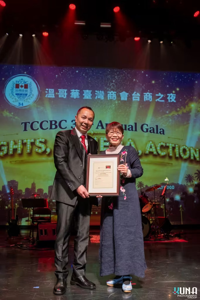Certificate presentation MLA Teresa Wat Vancouver gala photography President Eddie Chen presenting a framed certificate to BC Conservative MLA Teresa Wat during a Vancouver gala photography session in British Columbia.
