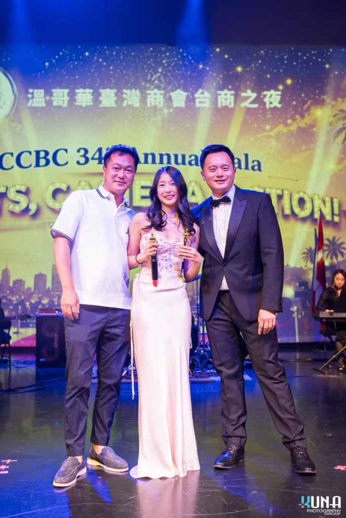 Mini Oscar trophy winners group portrait at TCCBC Gala Three attendees smiling brightly while holding miniature Oscar statue trophies on stage.