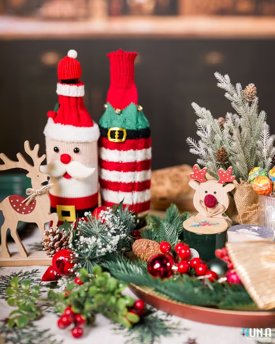Close-up of charming Santa and elf bottle covers used as festive props for Vancouver Christmas Mini Sessions.