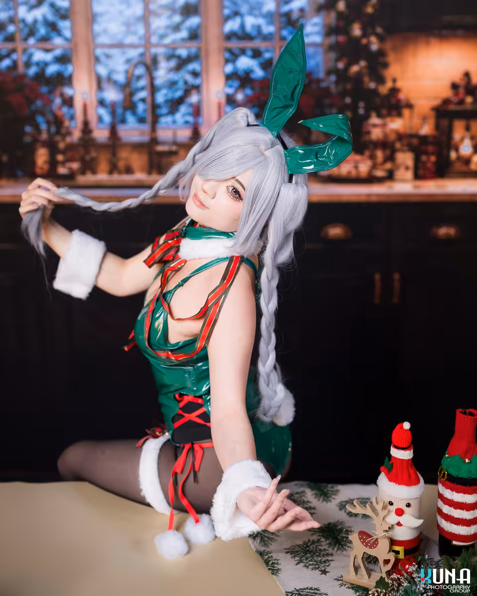 Cosplayer interacting with the camera during a Vancouver holiday photography session featuring intricate costume details.