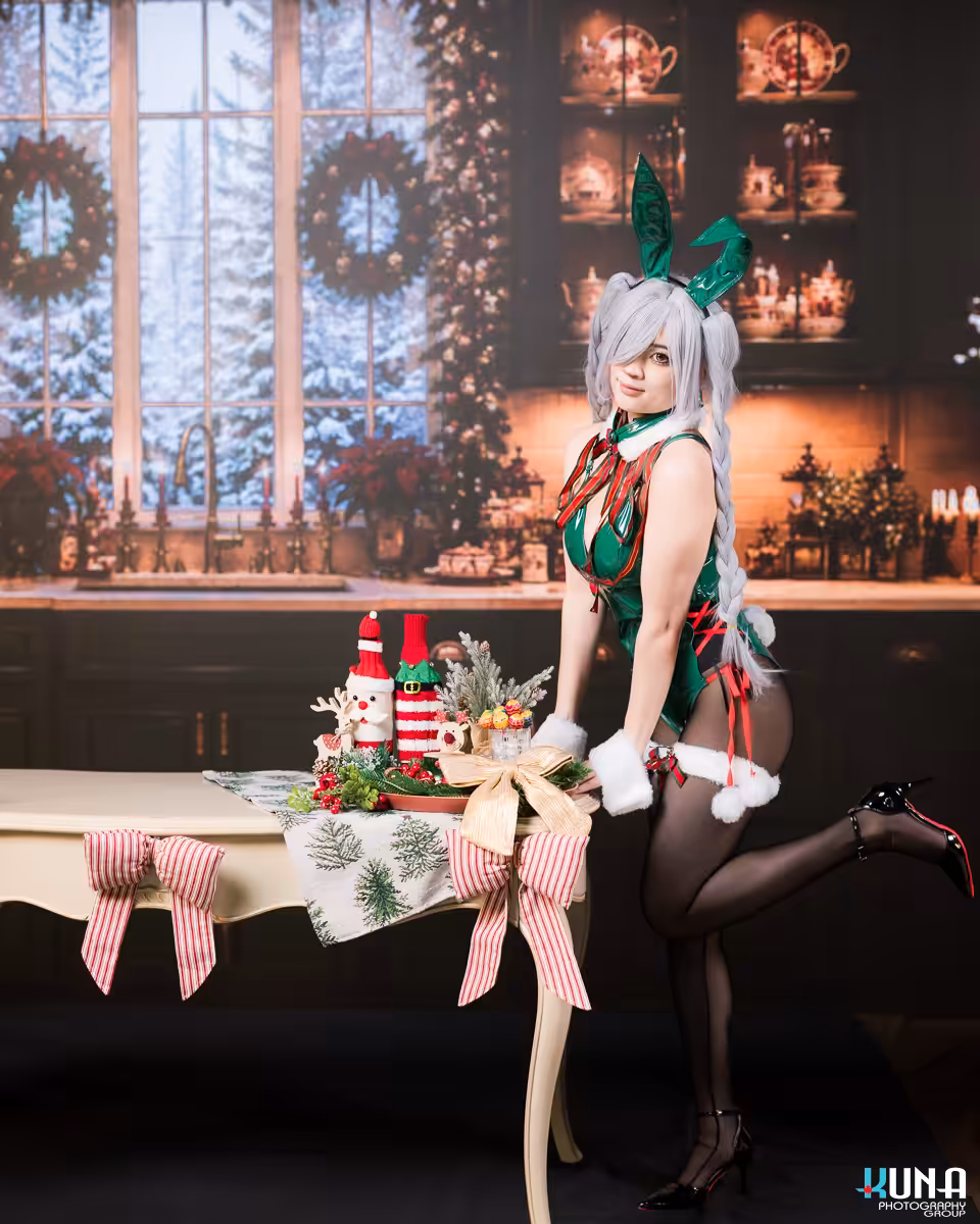 Festive holiday cosplay photography in British Columbia showcasing a winter window kitchen scene displayed on a high resolution LED screen.